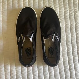 Black and white slip on vans